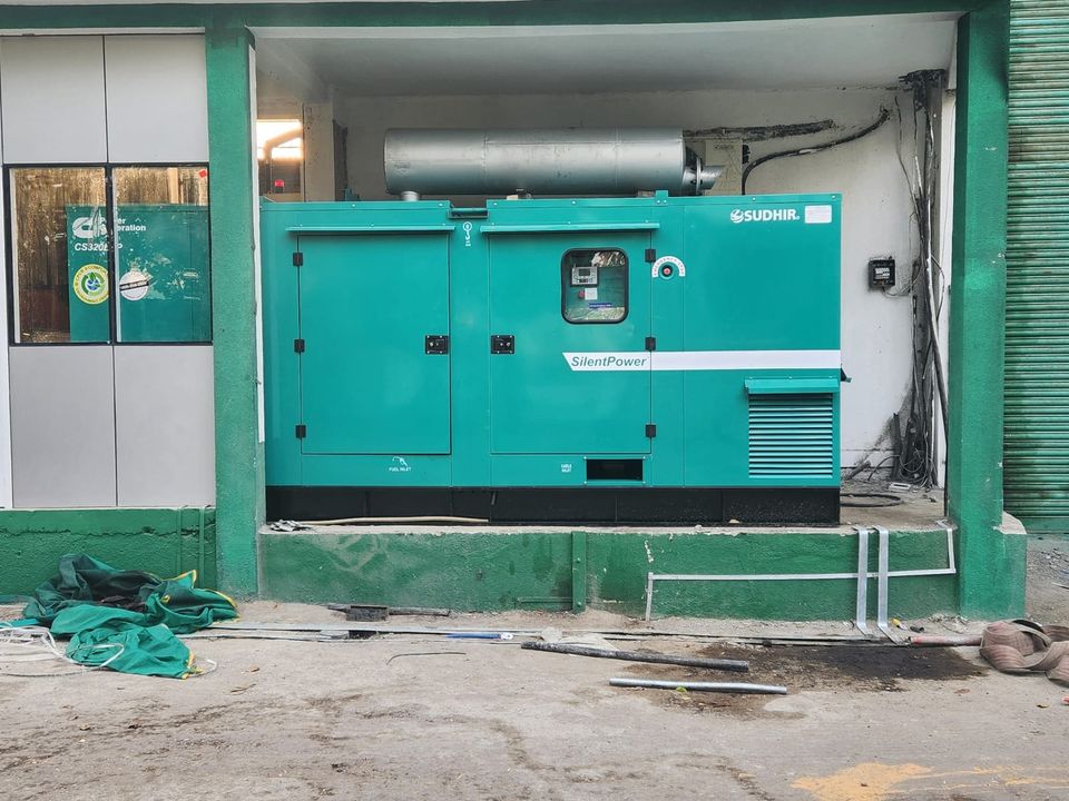 An installed 320 kVA Cummins silent DG set with residential silencer