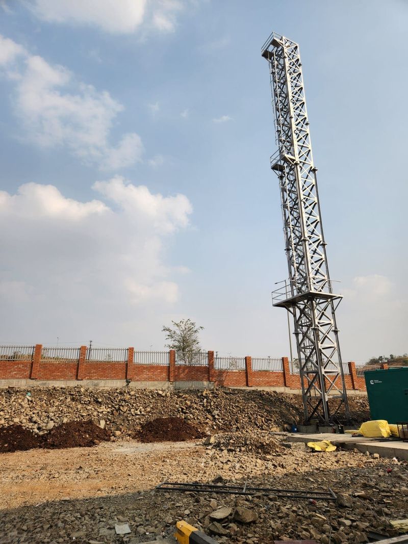 Erected 30 metre self-supporting lattice stack with ladder and rest platforms
